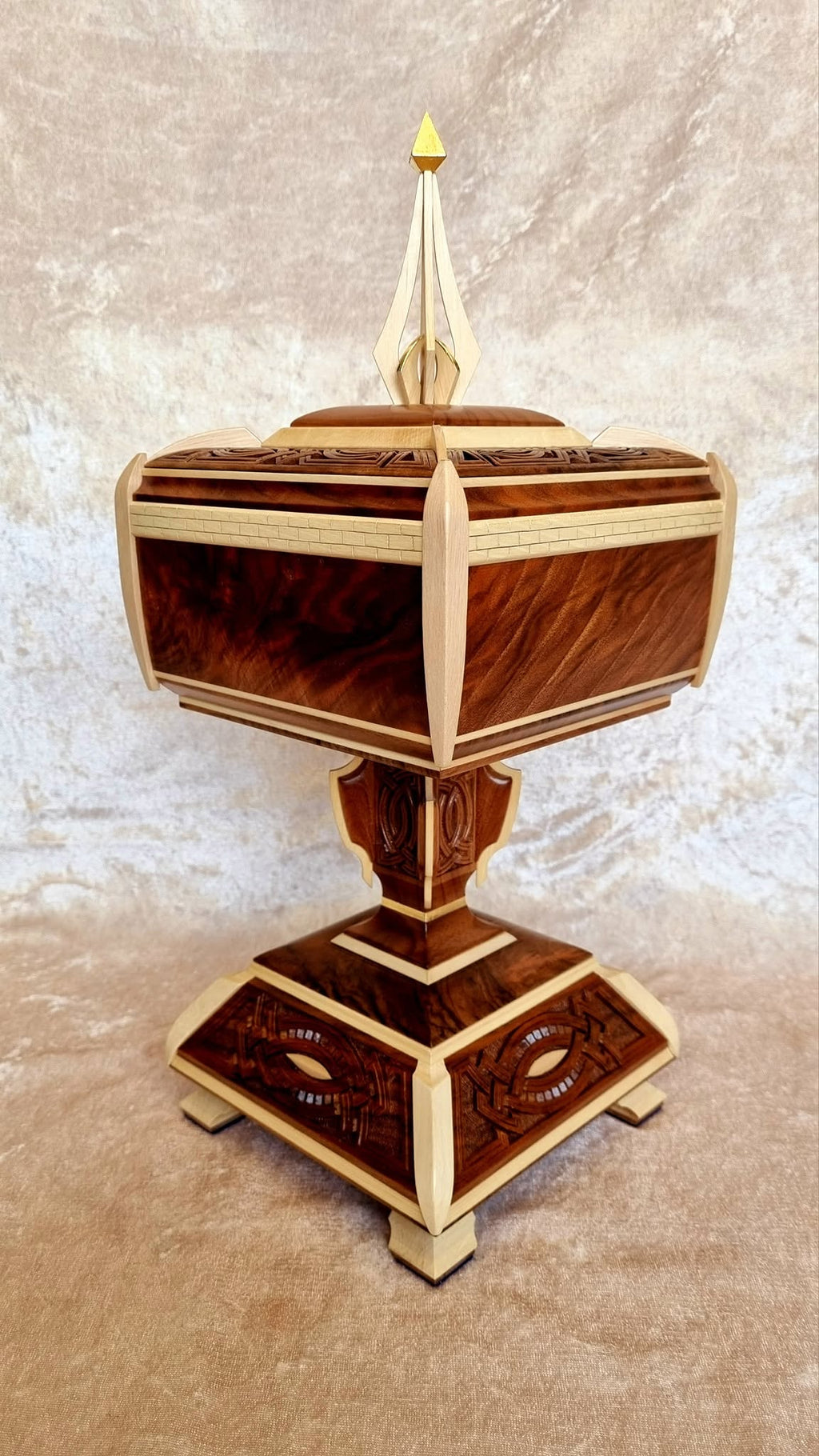 Secret Compartment Box on pedestal — three-quarter view