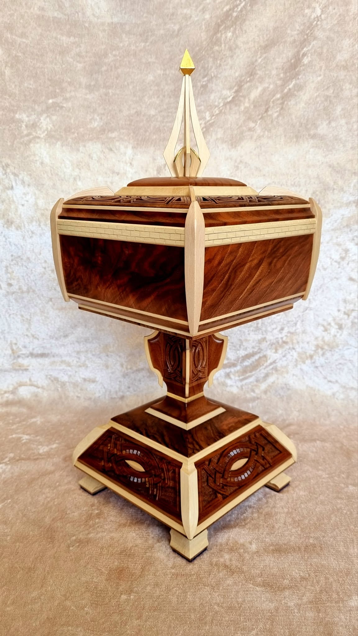 Secret Compartment Box on pedestal — three-quarter view