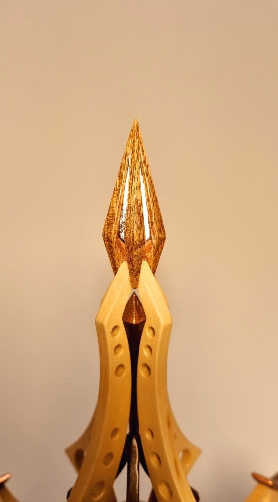 Copper-leaf flame finial detail