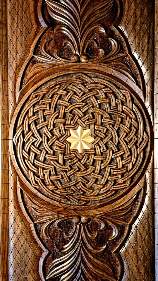 Exterior rosette — deep-carved interlaced knotwork with star center