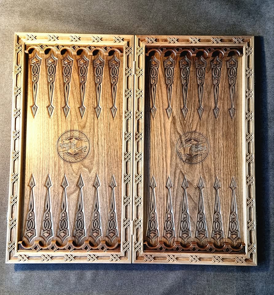 Backgammon halves standing upright showing carved interior