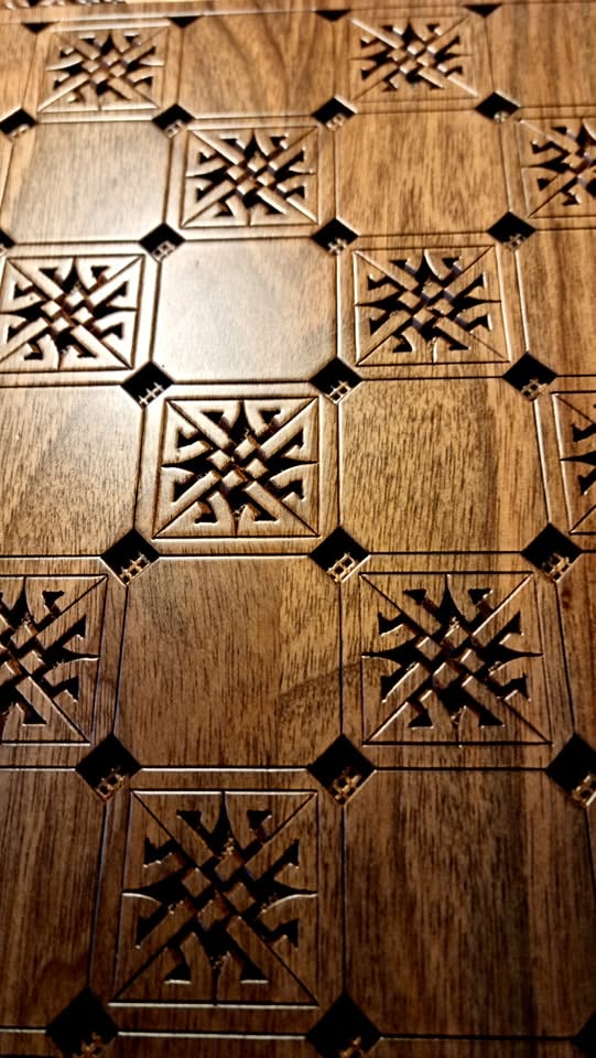 Checker field with carved star motifs