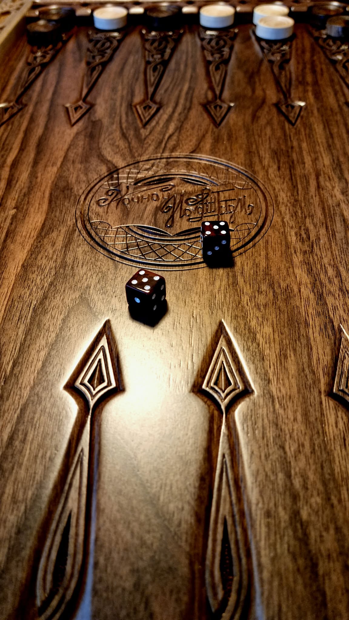 Dice anchors and maker's mark on the playing field