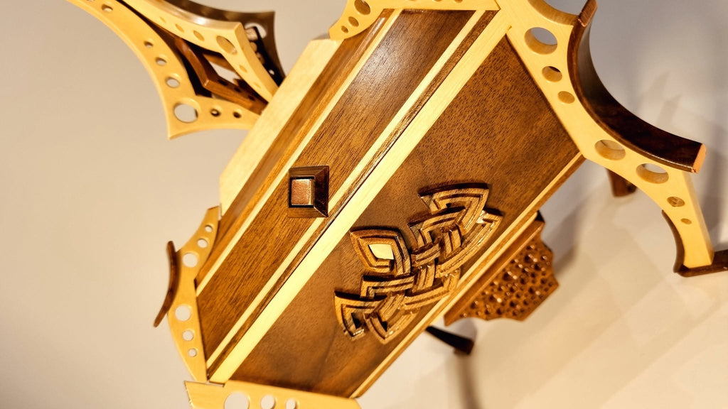 Lid carving detail — interlaced knotwork on walnut