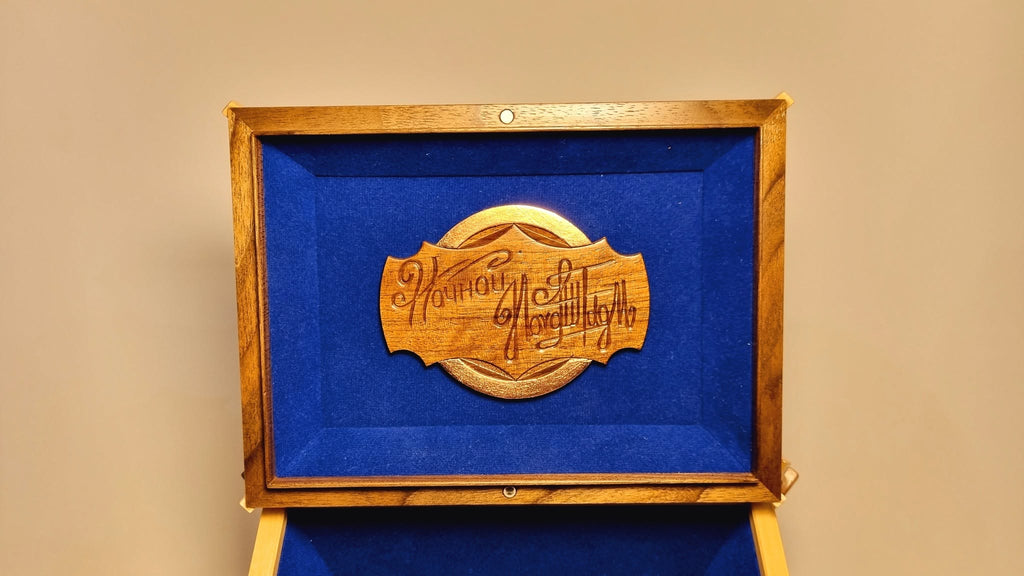 Carved maker's nameplate on velvet