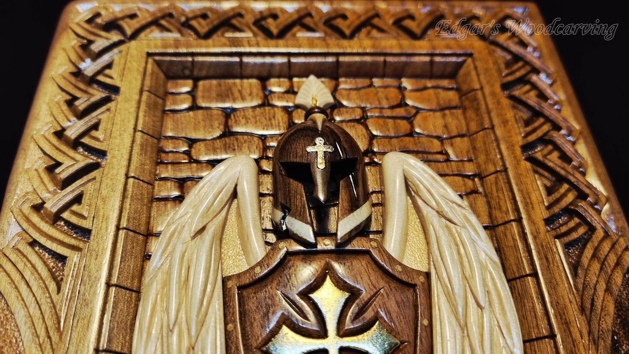 Helmet and wings — carving detail