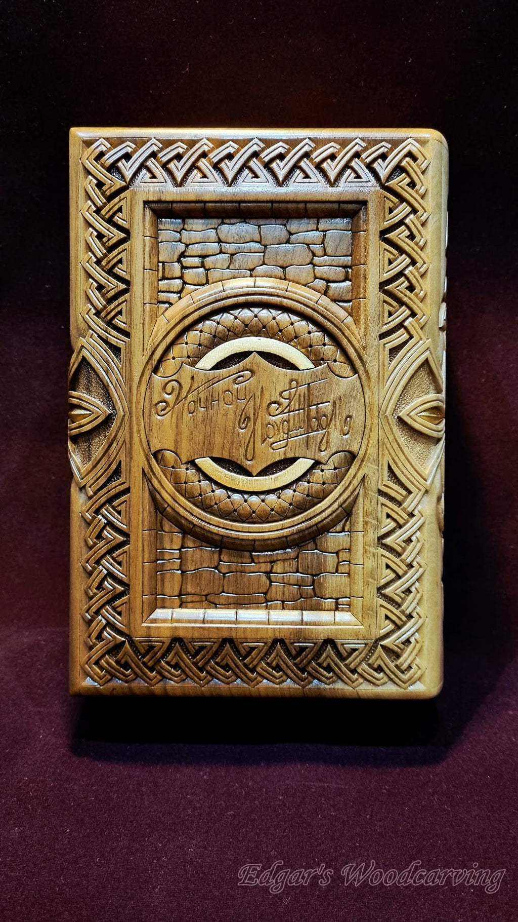 Back cover — carved inscription medallion