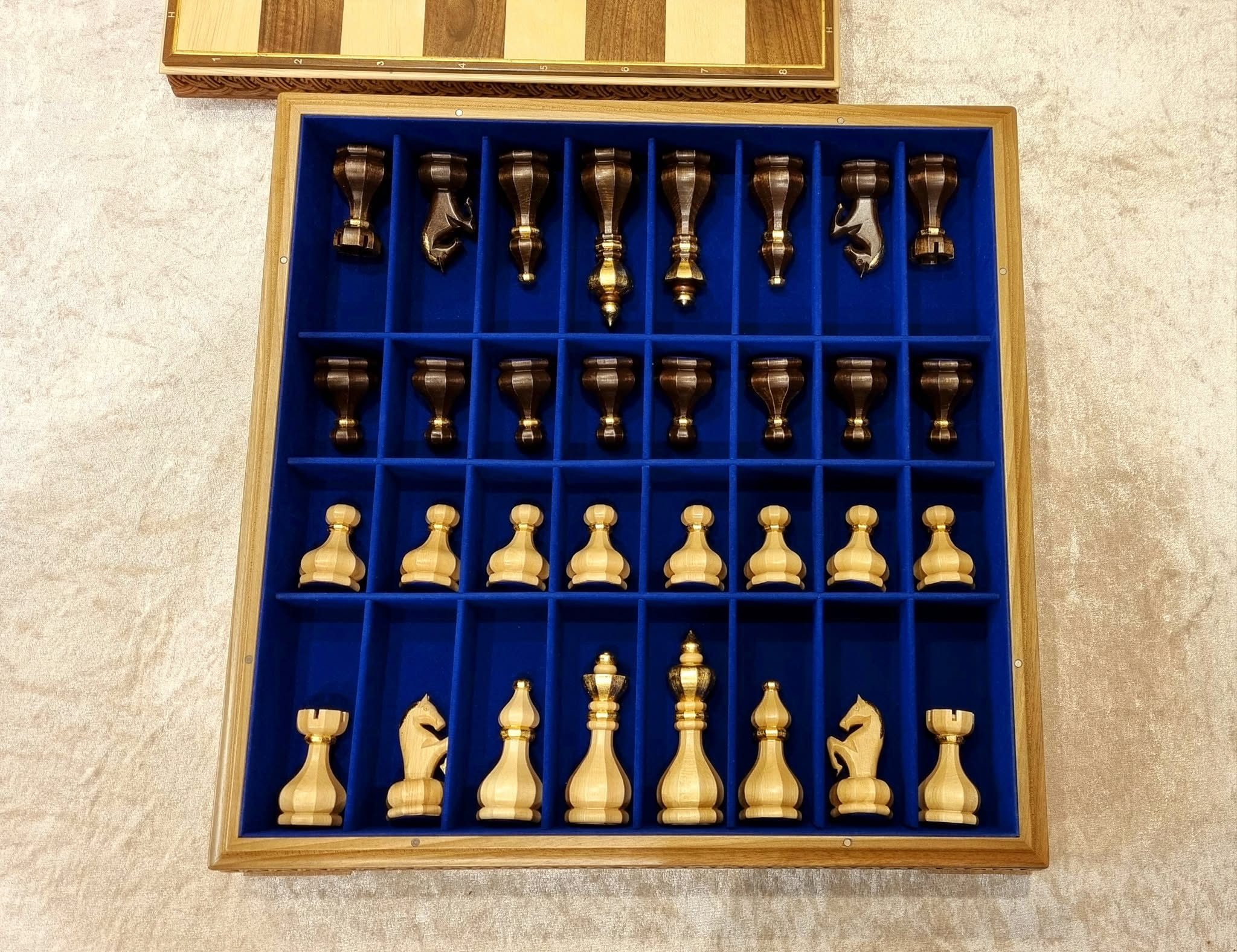 Chess Set by Edgar Hovhannisyan — gilded pieces in the blue velvet tray
